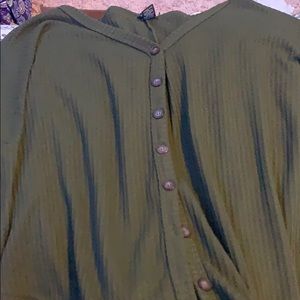 a dark green sweater buttons